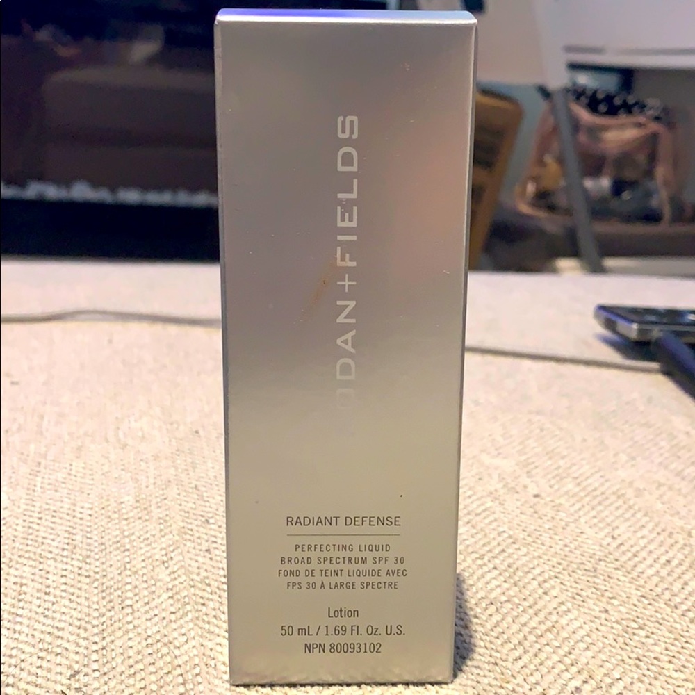 Radiant defense perfecting liquid shade cream